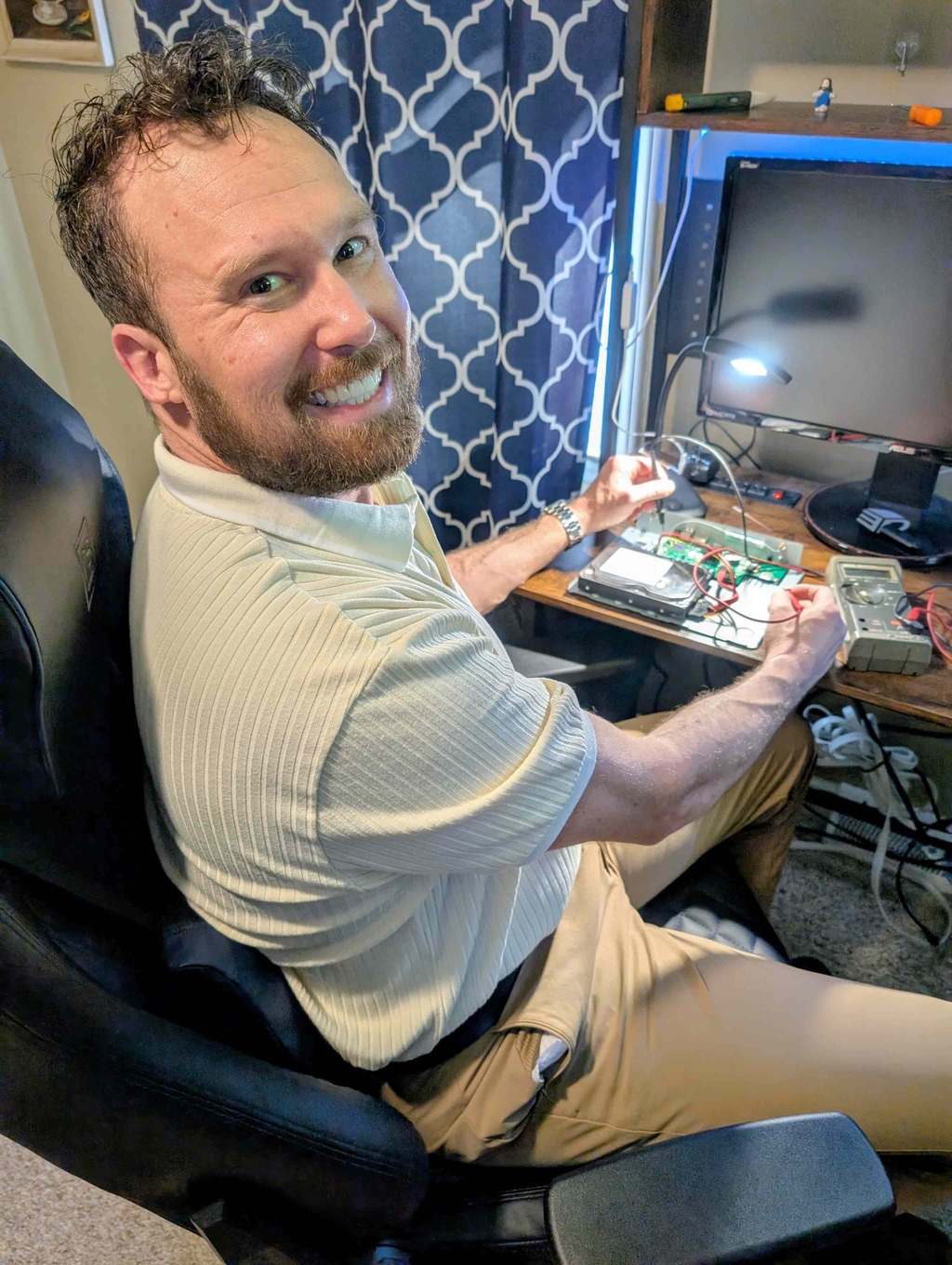 Founder of Simplified Security Solutions performing a forensic motherboard audit on a security DVR.